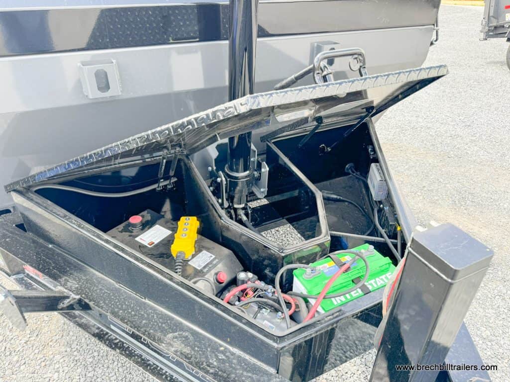 View of battery box with control remote and power lines.