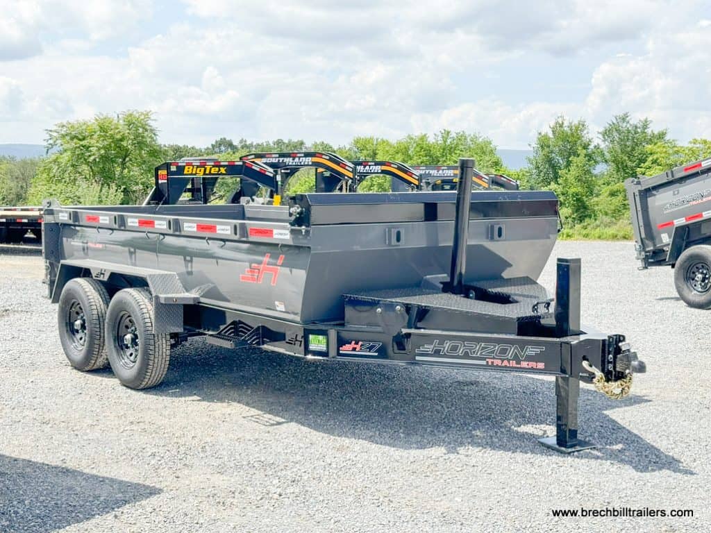 A gray Horizon HD 14k Dump Trailer parked in the lot.