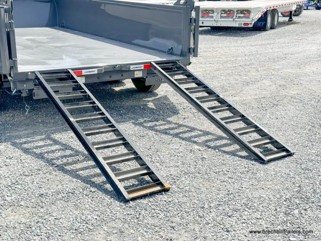 Ramps down on the trailer.
