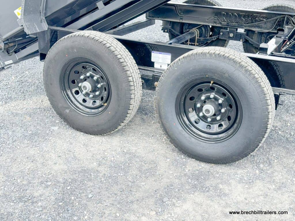 Dual axles with new black wheels.