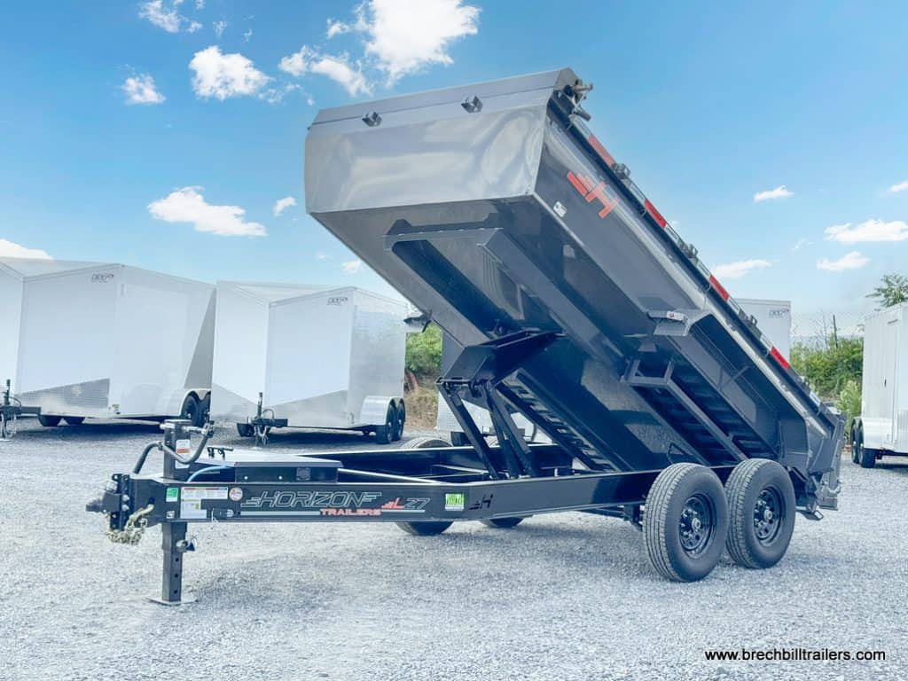 A gray Horizon 14k Heavy Duty Dump Trailer in the dump position on display.