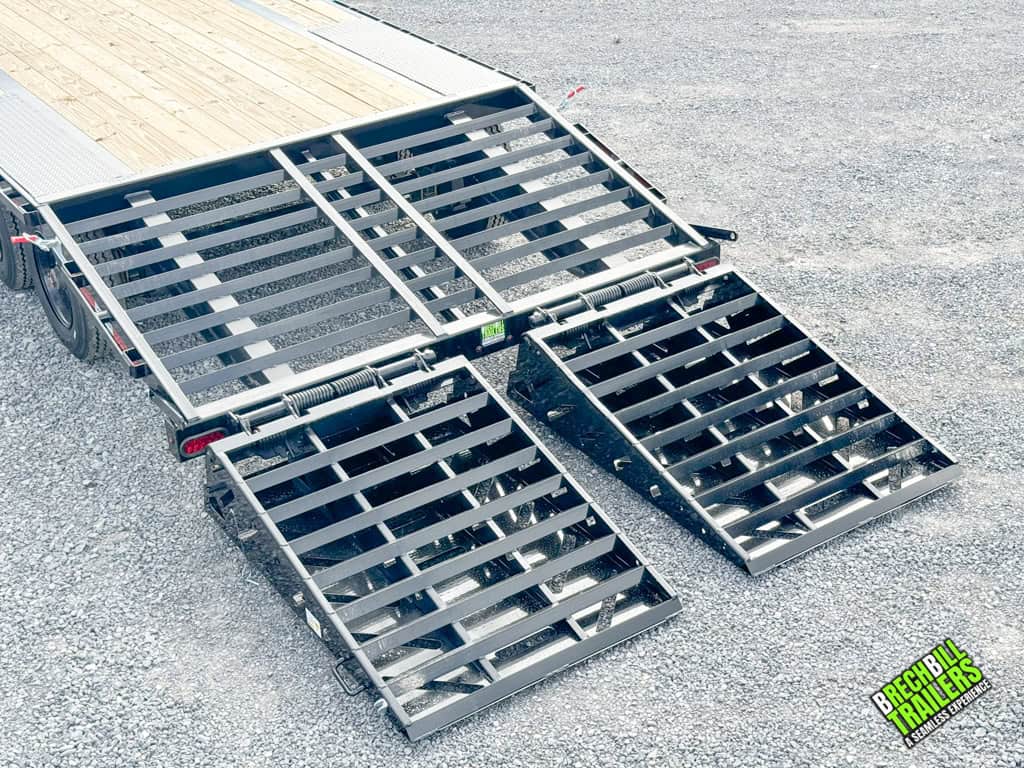 Black ramps down on a trailer.