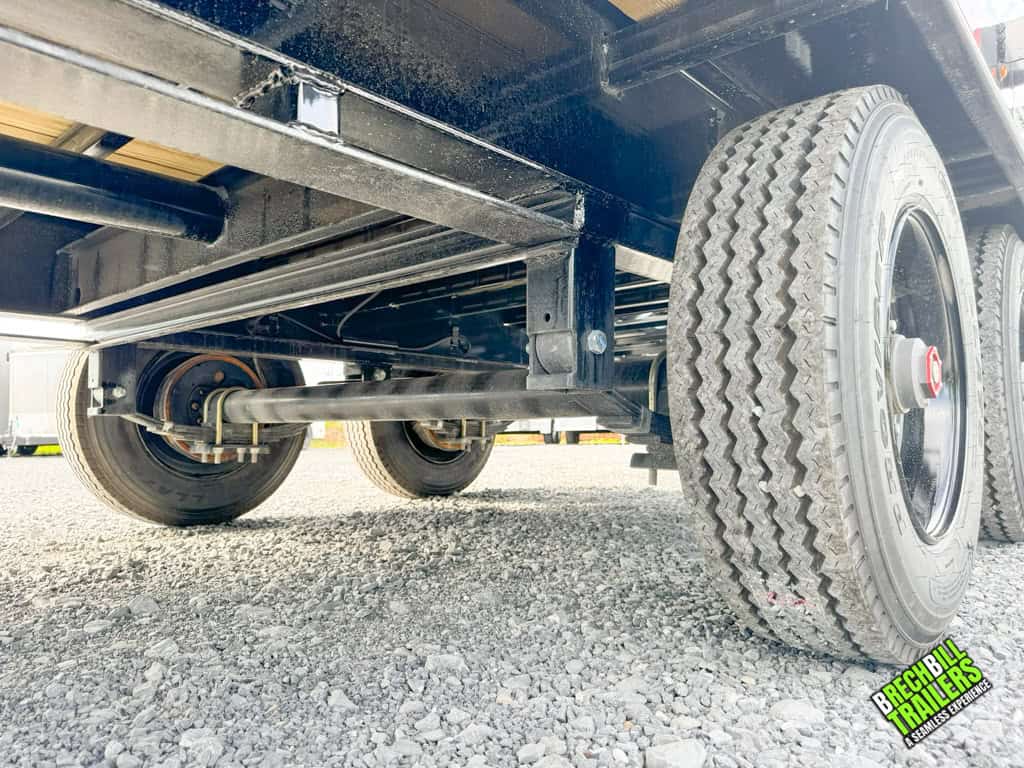 The axles and suspension on the Horizon 24ft Flatdeck Gooseneck Trailer.