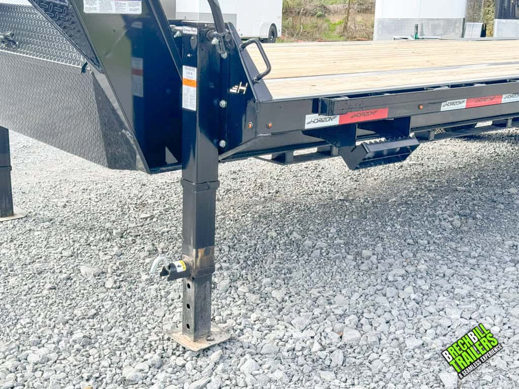Jacks holding up the Horizon 24ft Flatdeck Gooseneck Trailer.