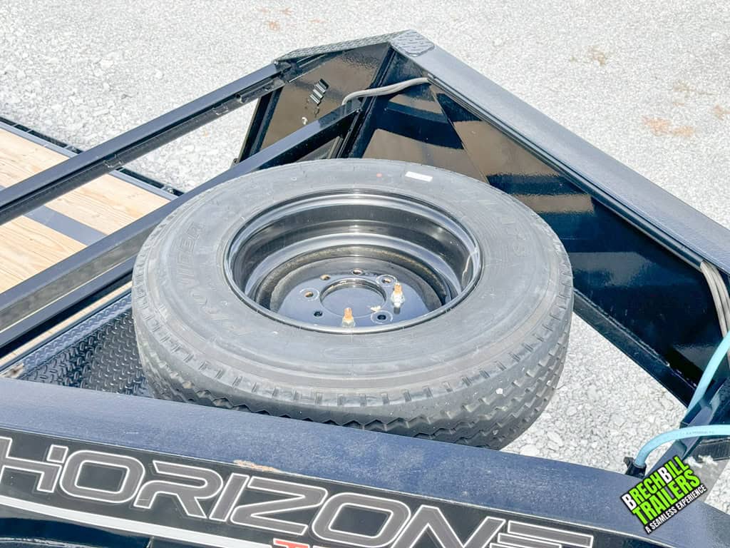 Spare wheel mounted on the trailer.