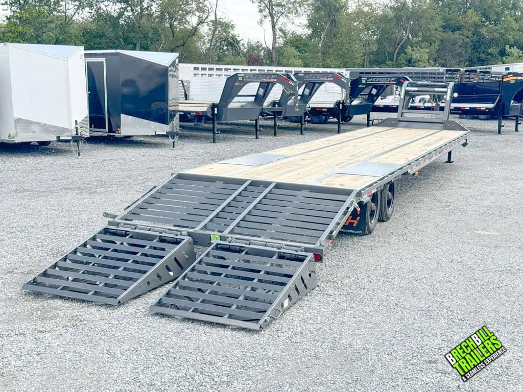 Horizon 40ft Flat Deck Gooseneck Trailer with the ramps down.