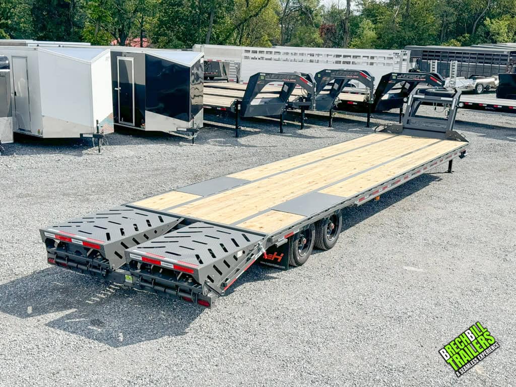 Brechbill Trailers lot with the Horizon 40ft Flat Deck Gooseneck Trailer parked on display.