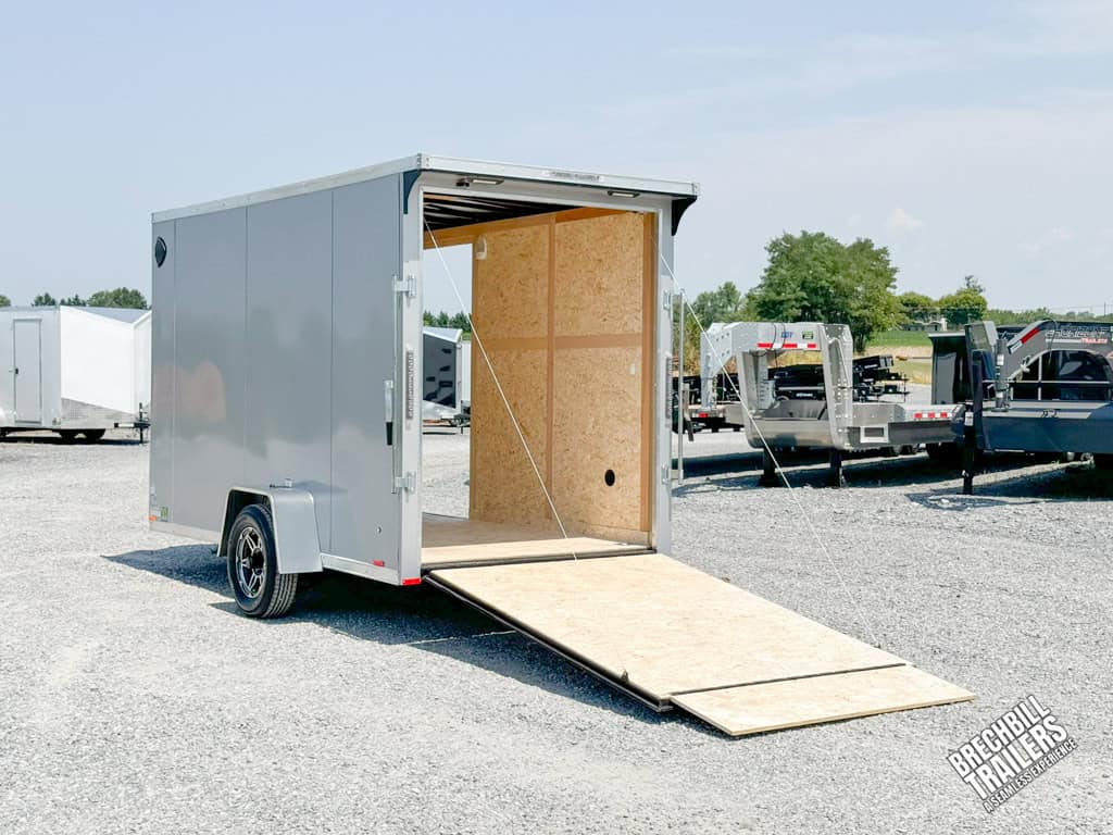 RC Flat Top Wedge Enclosed Cargo Trailer with ramp down for display.