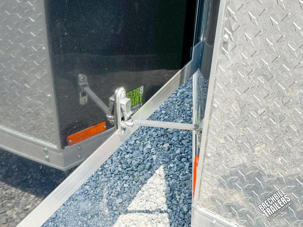 Latch holding the enclosed trailer's door open