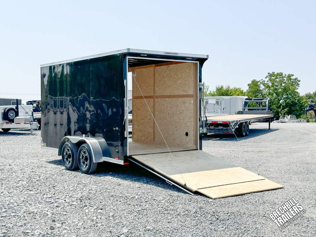 RC Flat Top Wedge Enclosed Cargo Trailer on display with the ramp door down.
