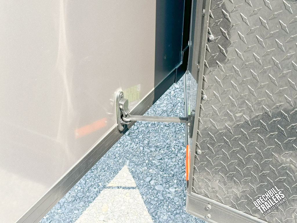 RC Flat Top Wedge Enclosed Cargo Trailer door being held open.