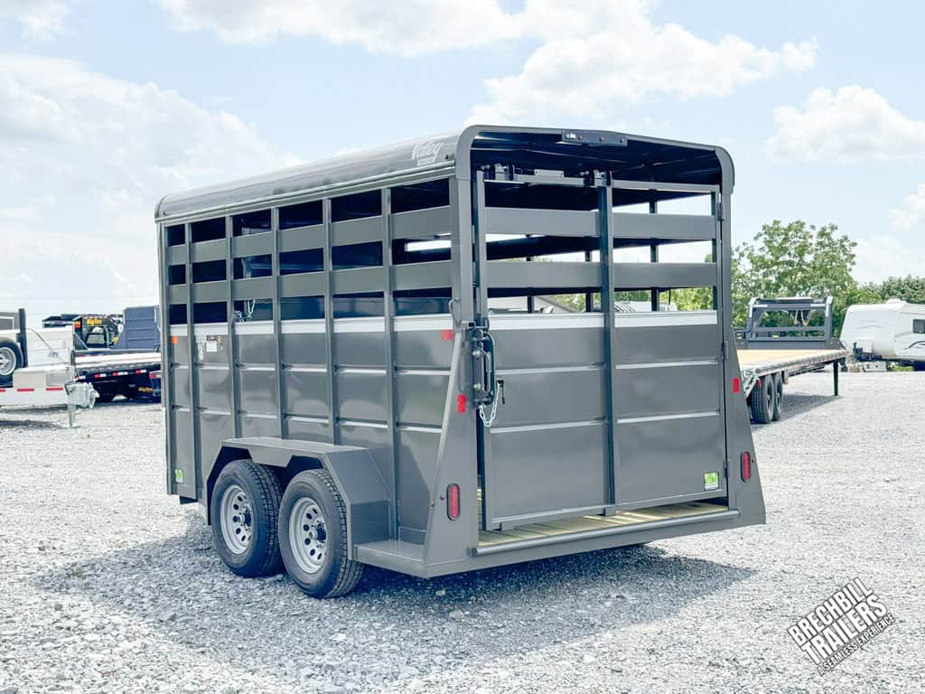 A Valley 7x14 High Side Stock Trailer parked in the Brechbill Trailers lot.