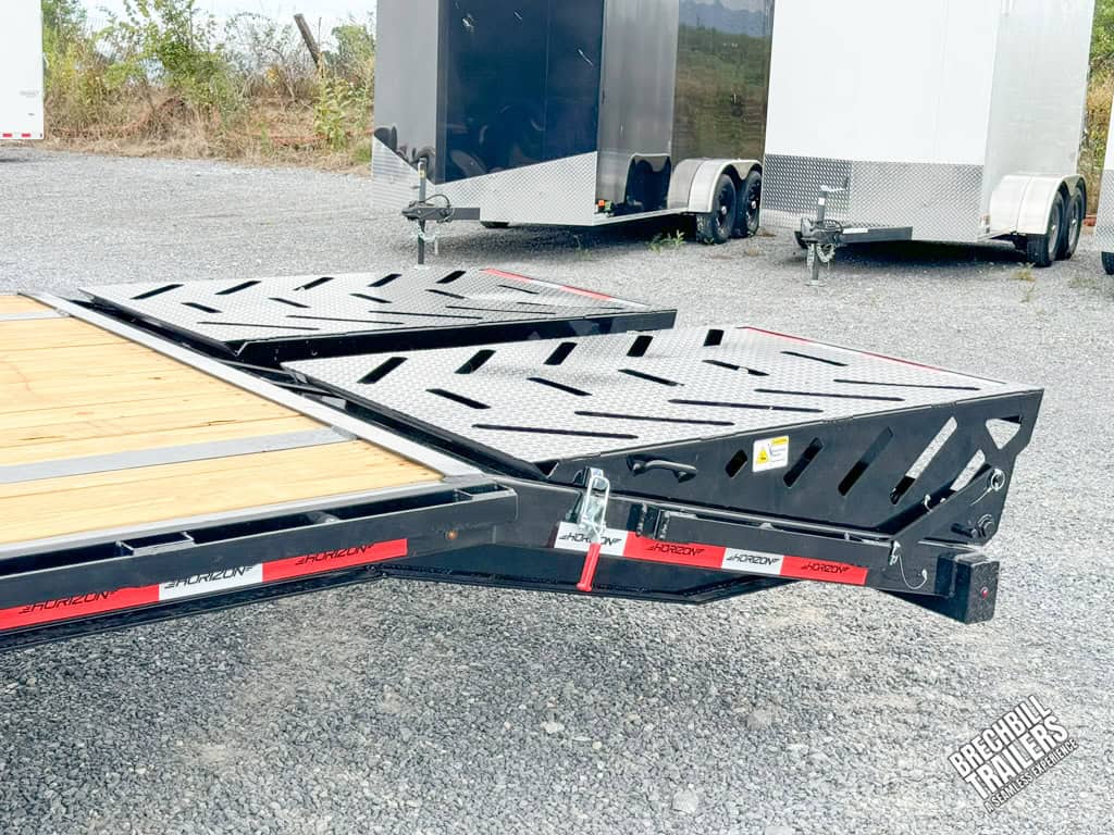 Ramps laying flat on the trailer.