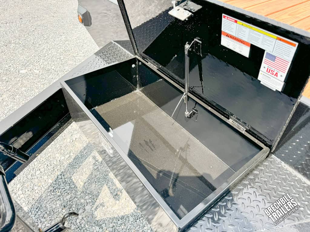 Open toolbox mounted on the Bwise 17K HD Deck Over Equipment Trailer
