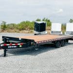A parked Bwise 17K HD Deck Over Equipment Trailer for sale.
