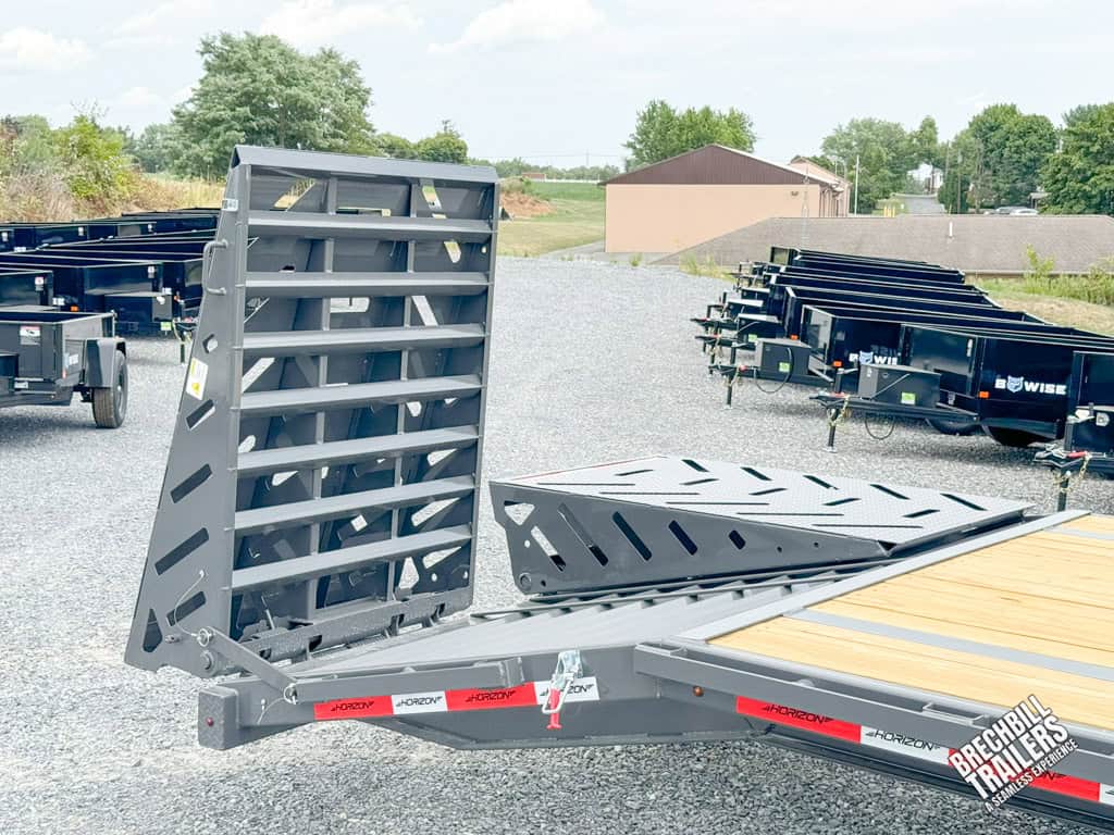 Folding out the ramps on a Horizon 36ft Deck Over Gooseneck Trailer