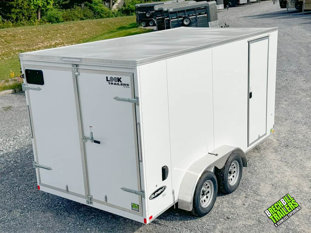 A white Look Element Enclosed Cargo Trailer parked in a lot.