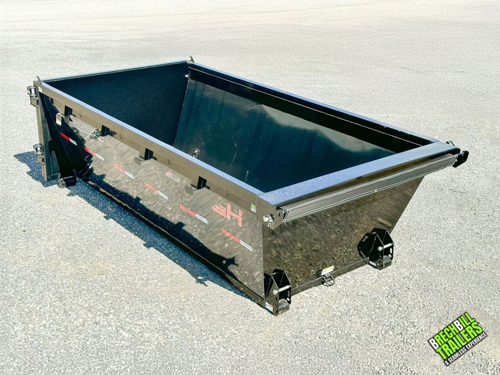 A brand new EDZ-14 Horizon Roll Off Dumpster on the ground.