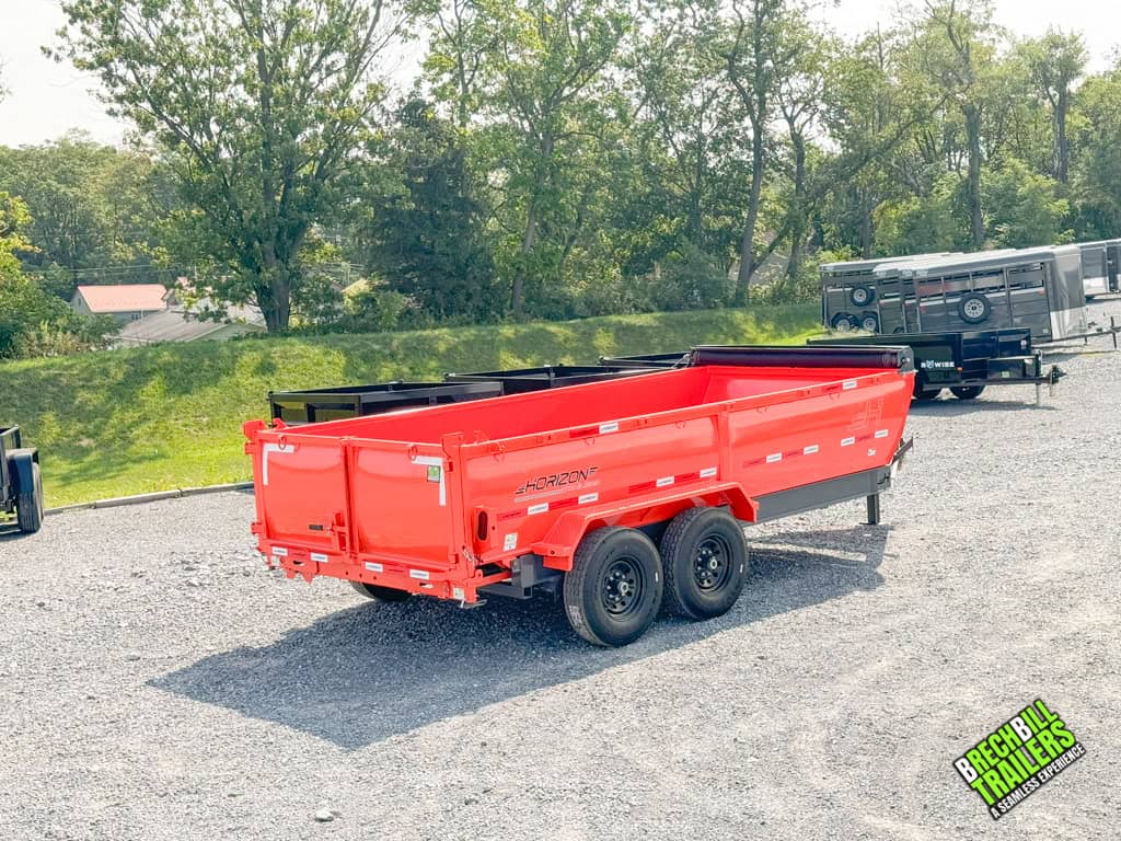 A Horizon 14k Heavy Duty Dump Trailer with a black frame and orange box.