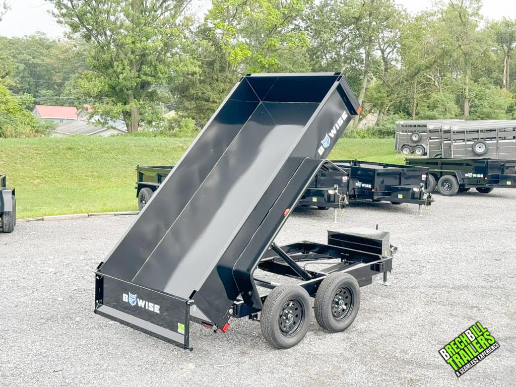 The Bwise 5x10 Small Dump Trailer in the dumping position.
