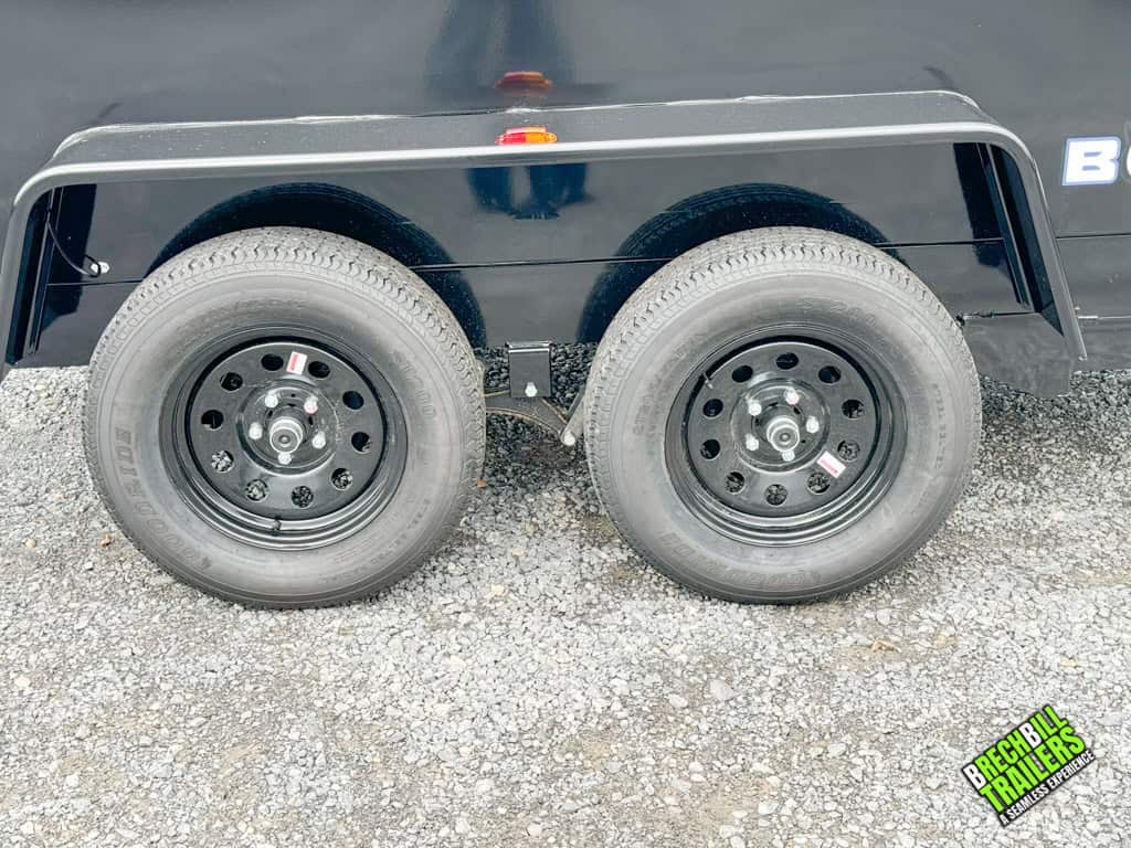 Black wheels on a black Bwise dump trailer.