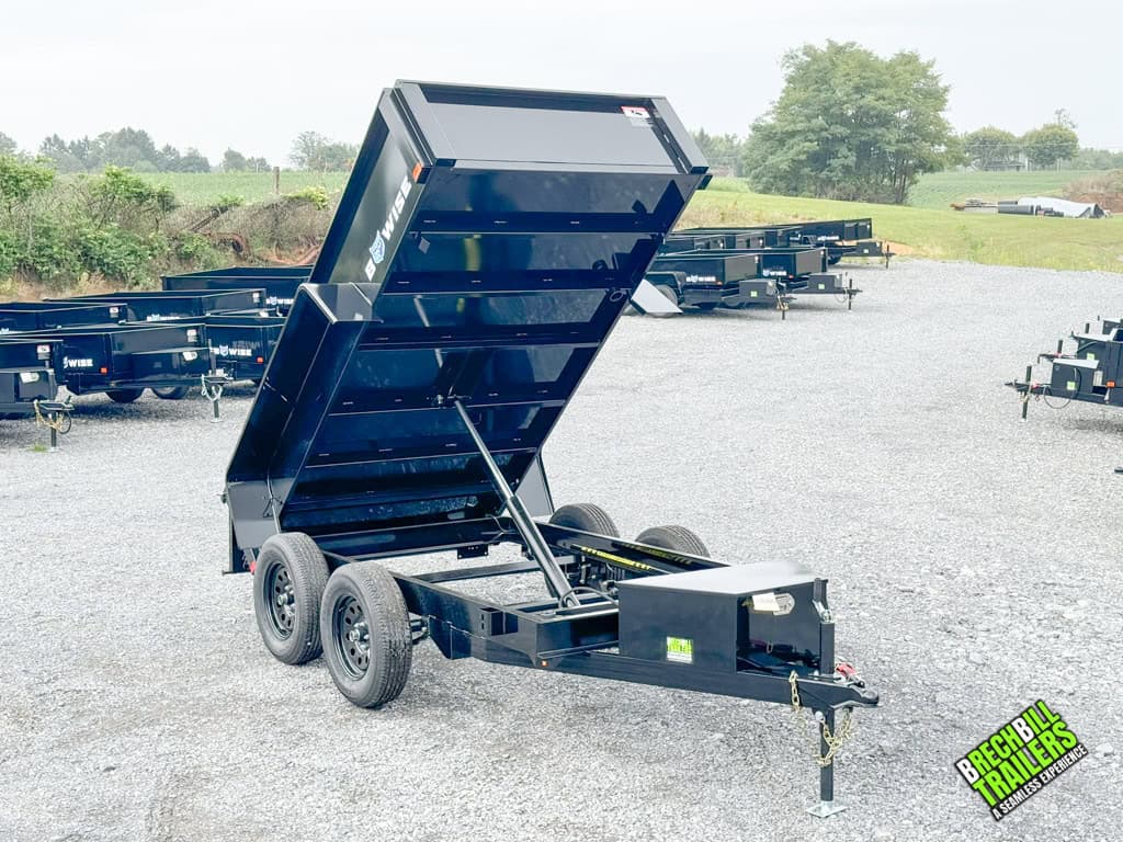 The hydraulic cylinder putting the Bwise 5x10 Small Dump Trailer in the dumping position.