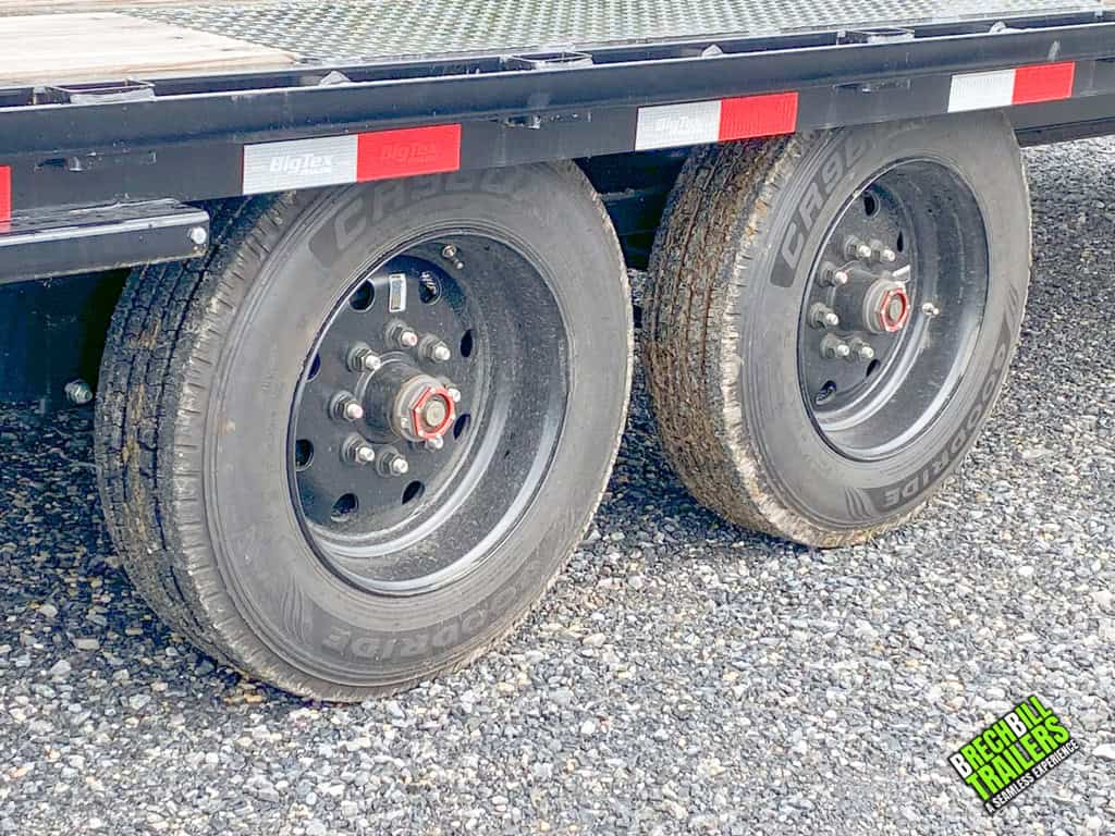 Black wheels on the dual axle gooseneck trailer.