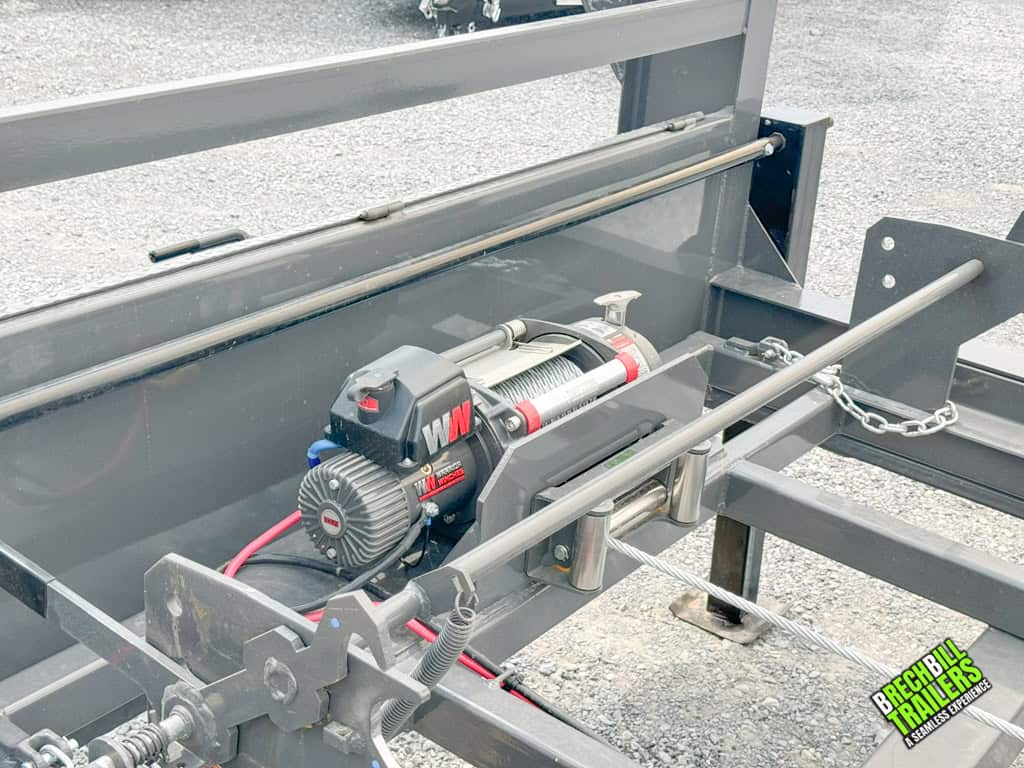 The winch for grabbing boxes on the roll off trailer.