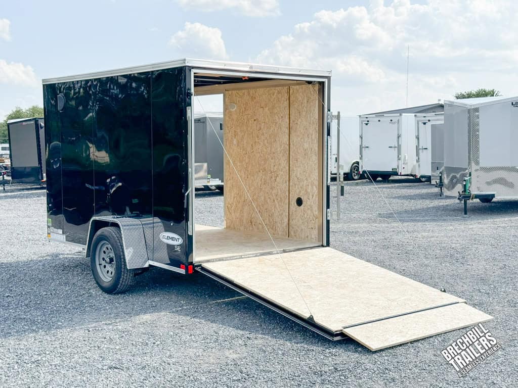 A black Look Enclosed Cargo Trailer with ramp down and door open