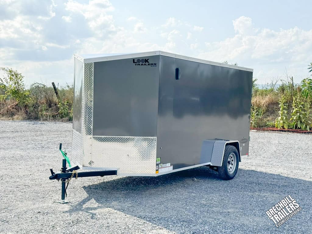 A parked silver Look Element V-Nose Enclosed Trailer