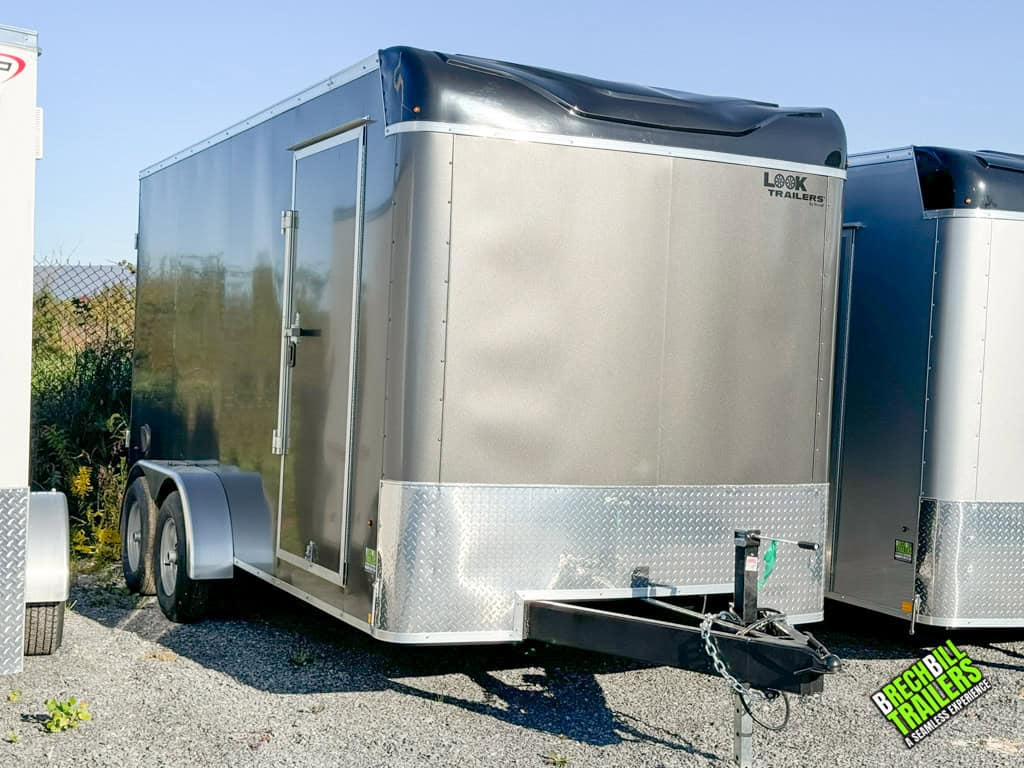 Look XLT Enclosed Bullnose Trailer parked next to others at the Brechbill Trailers lot