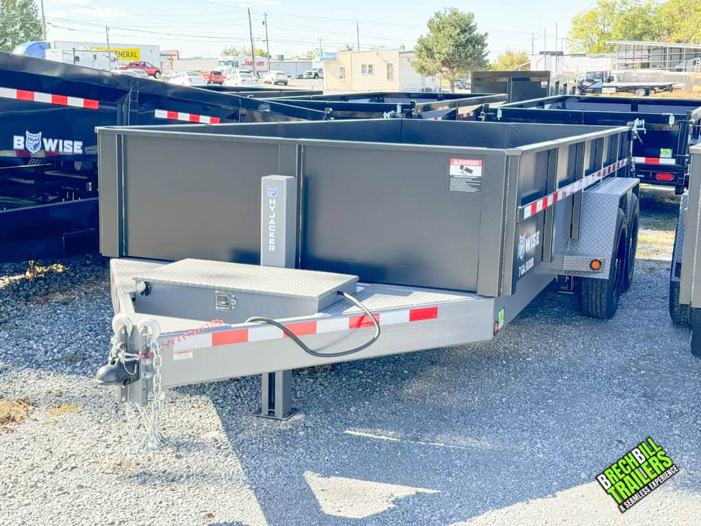 Coupler and toolbox seen in the front view of the Bwise DLP 15.4K HD 7GA Floor Dump Trailer