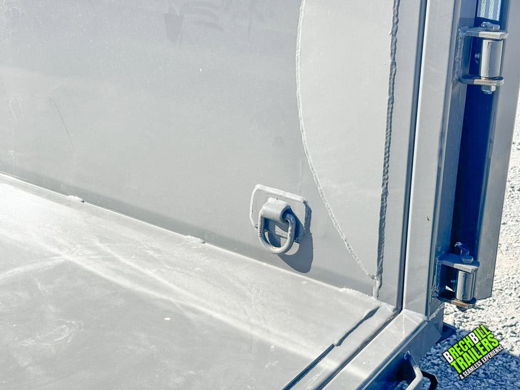 Inside the gray dump trailer.