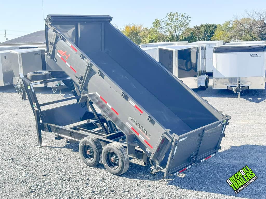 A 16ft long Horizon gray HD Gooseneck Dump Trailer in the dump position.
