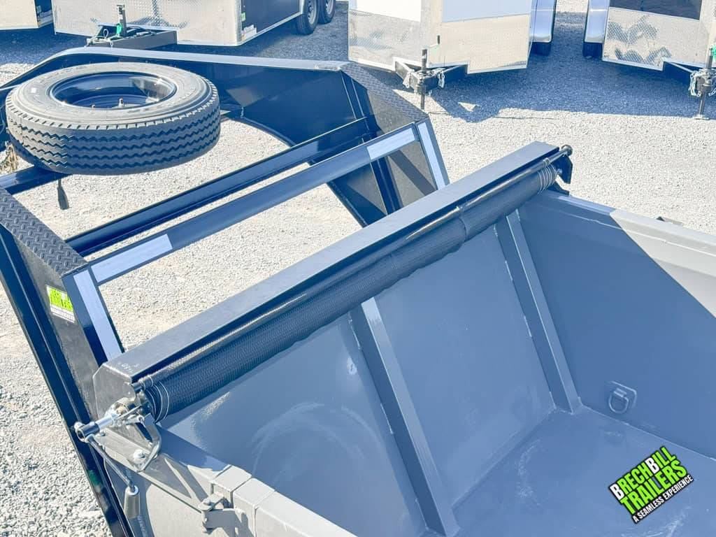 Close up view of the Horizon HD Gooseneck Dump Trailer tarp and spare wheel.