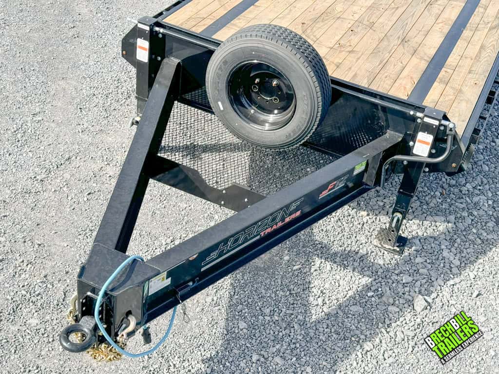 Spare wheel mounted on the front of the trailer.