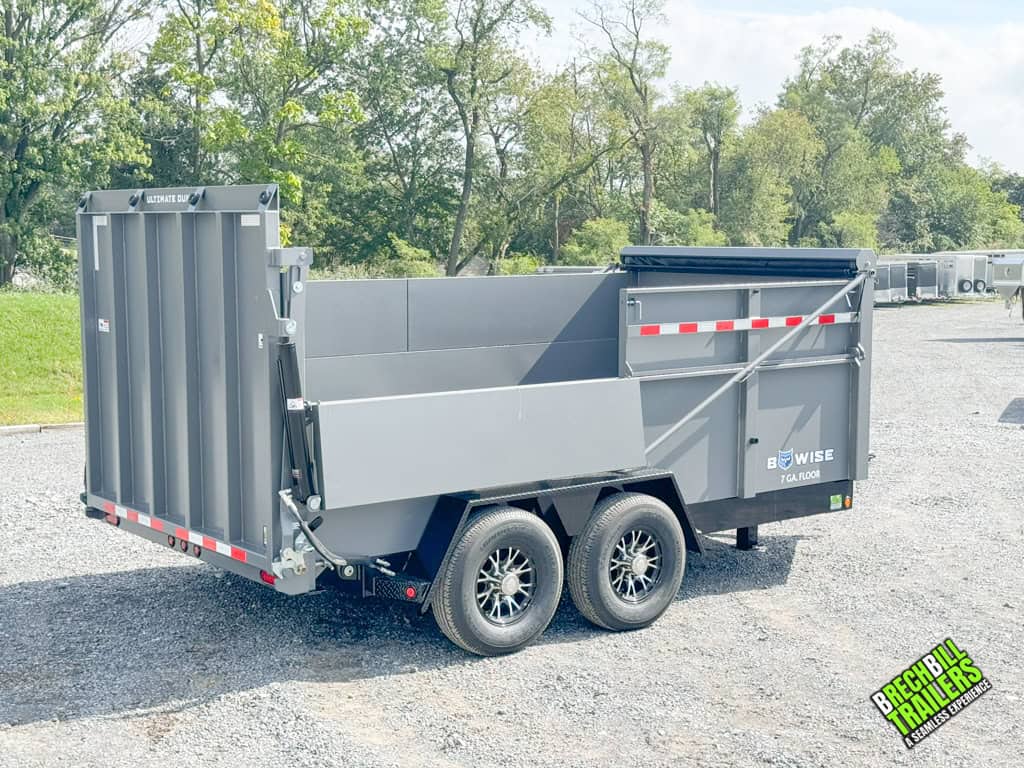 A gray Bwise DU 15.4K Ultimate Dump Trailer on display.