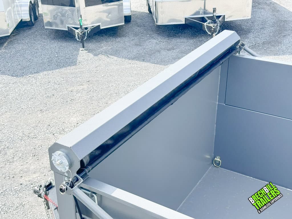 Tarp kit installed to secure loads on the Bwise DU 15.4K Ultimate Dump Trailer.