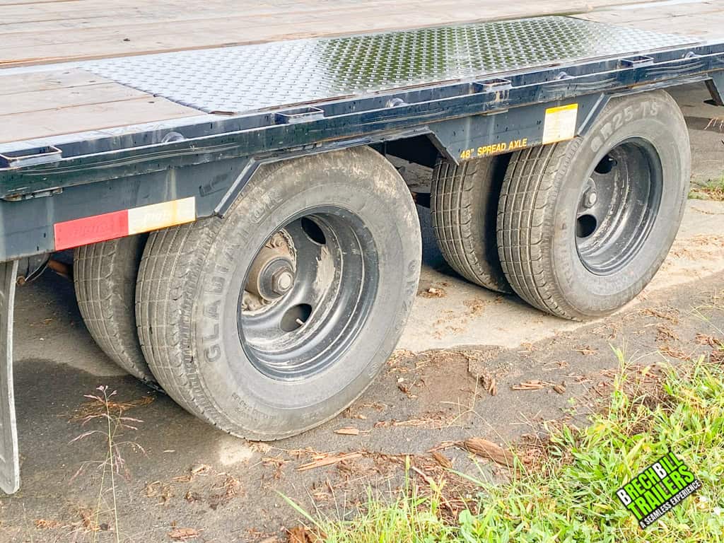 Dual axles and wheels on the Used Big Tex 25.9K HD Gooseneck Trailer