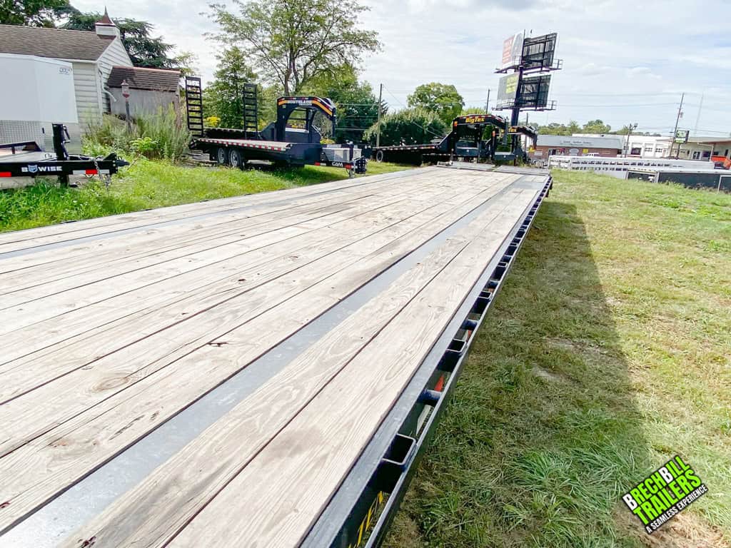 Flat deck made of wood on a 40ft Big Tex trailer.