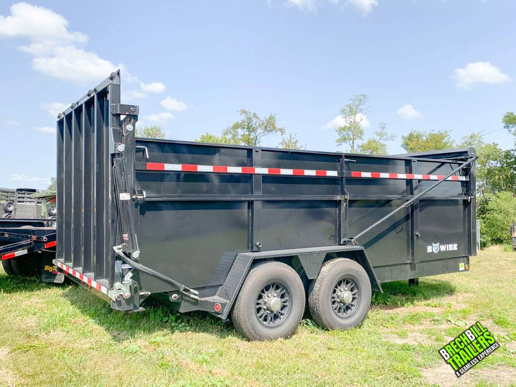 A black 16ft Used Bwise DU Ultimate Dump Trailer