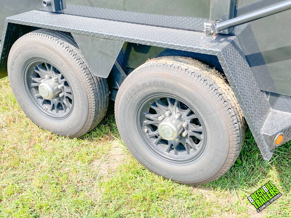 Wheels on a Used Bwise DU Ultimate Dump Trailer