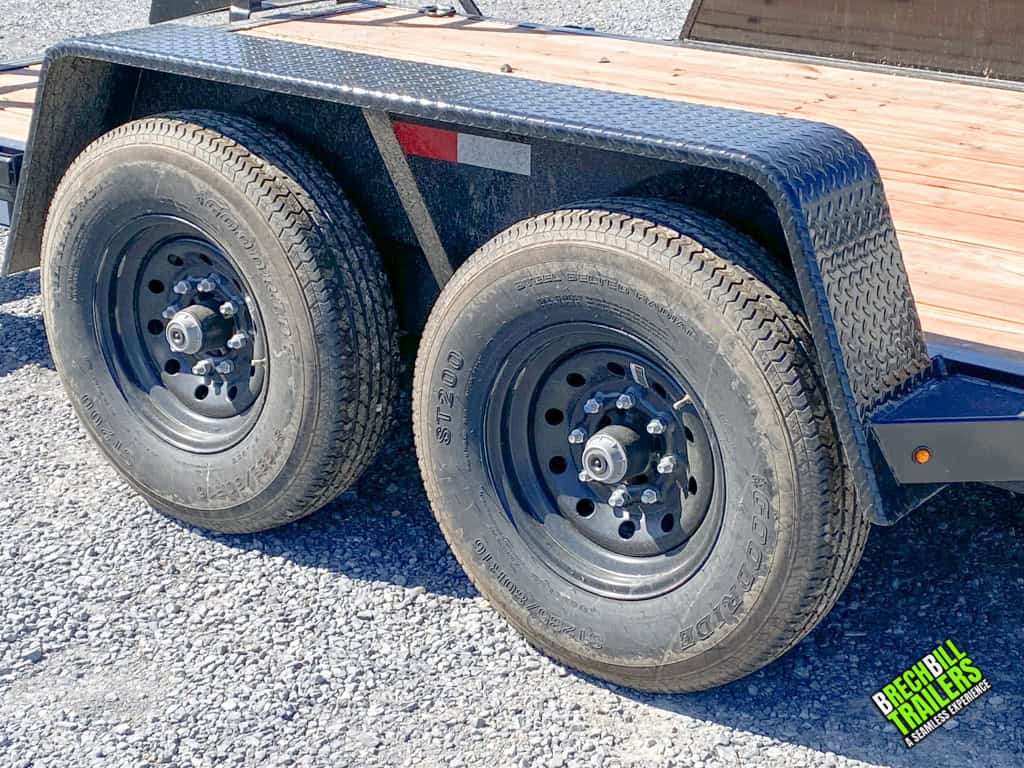 Wheels and fender on a Used Bwise EH 14K Heavy Duty Equipment Trailer