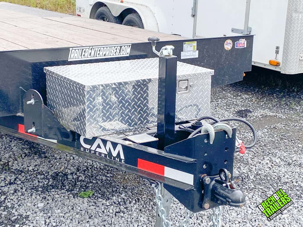The front of the Used CAM 11K Deck Over Equipment Trailer with a toolbox mounted.