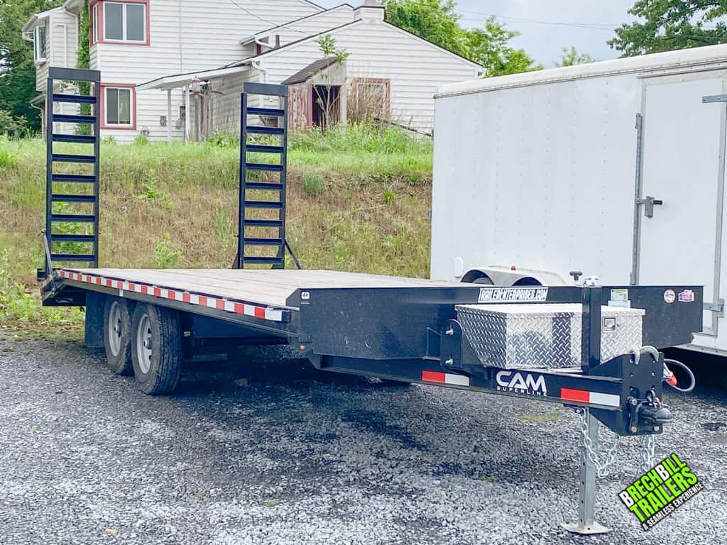 Front of Used CAM 11K Deck Over Equipment Trailer parked at the dealership.
