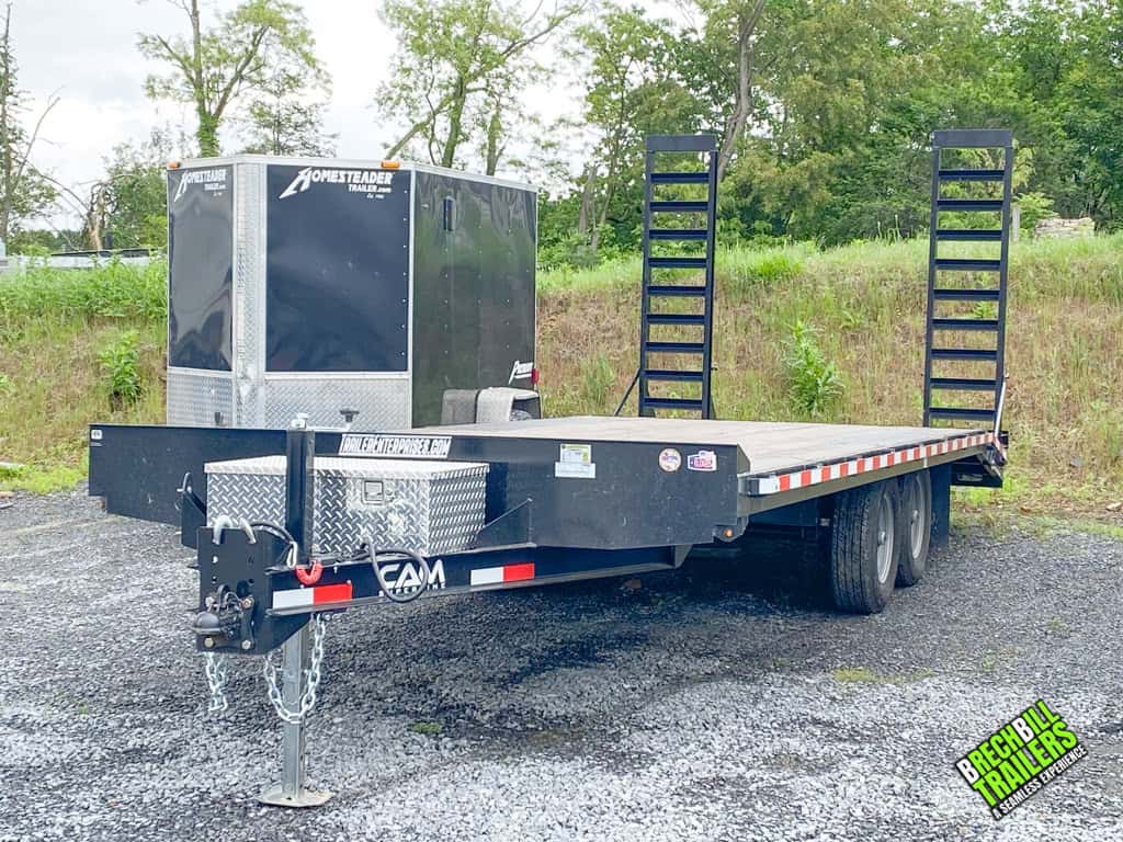 A Used CAM 11K Deck Over Equipment Trailer parked and marked for sale.