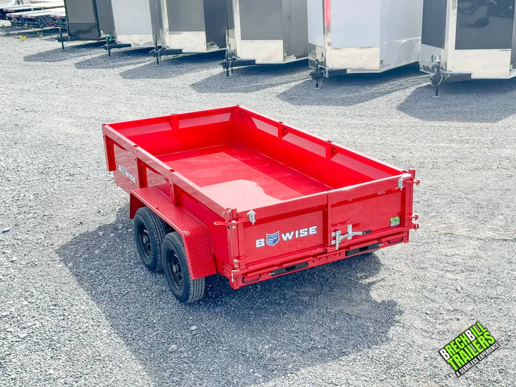 Back view of the parked Bwise LP LE 10K Low Pro Dump Trailer at Brechbill Trailers.