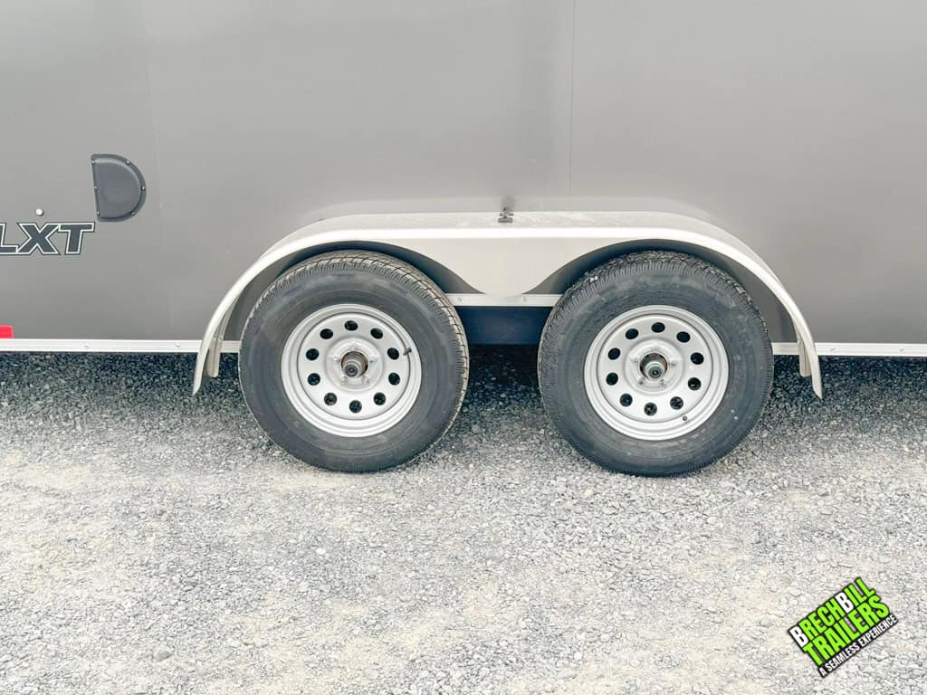 The wheels on a new Look Enclosed Bullnose Car Trailer.