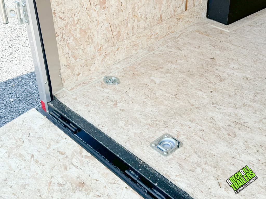 Recessed d-rings on the floor of the cargo trailer.