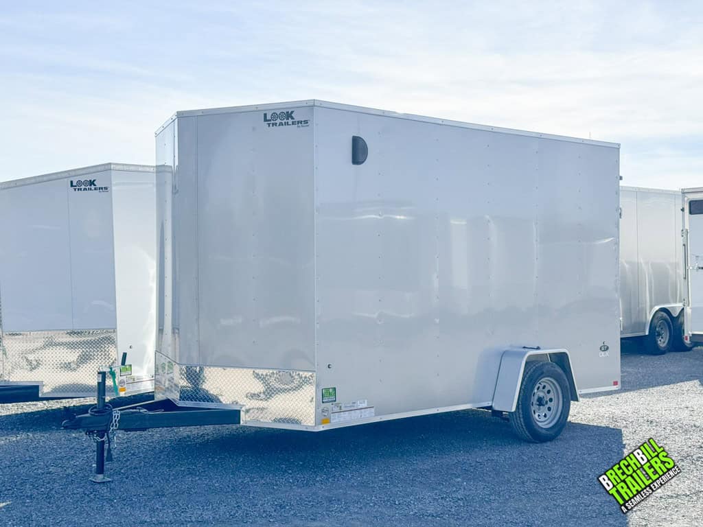 A brand new silver Look ST DLX Enclosed Cargo Trailer